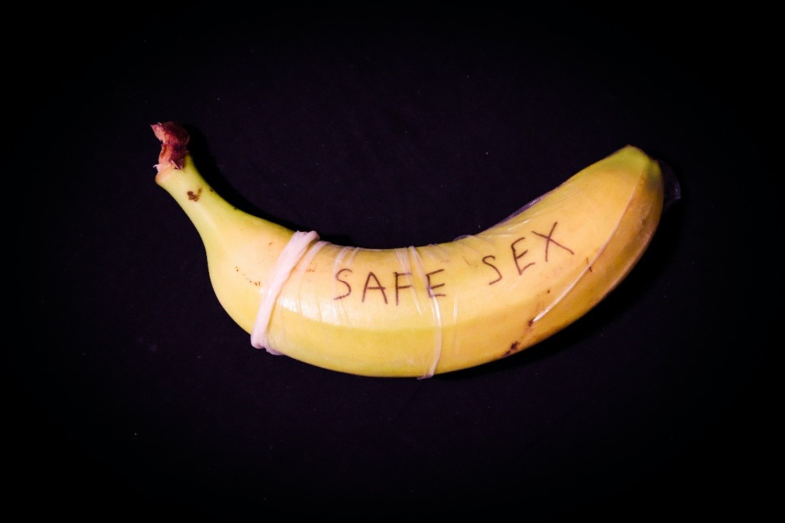 Condom on a banana encourages safe sex